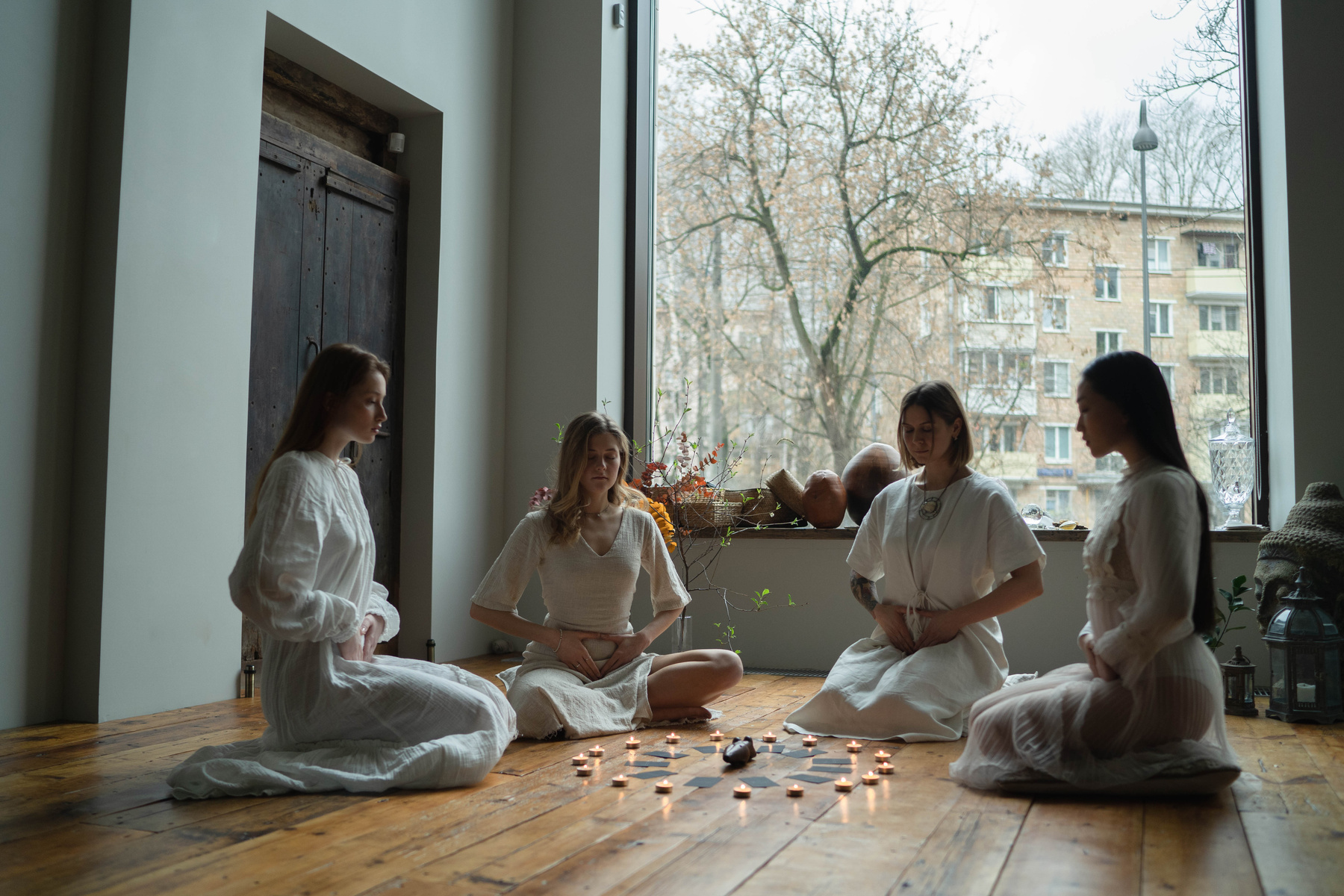Women in White Dresses Doing Ritual Together